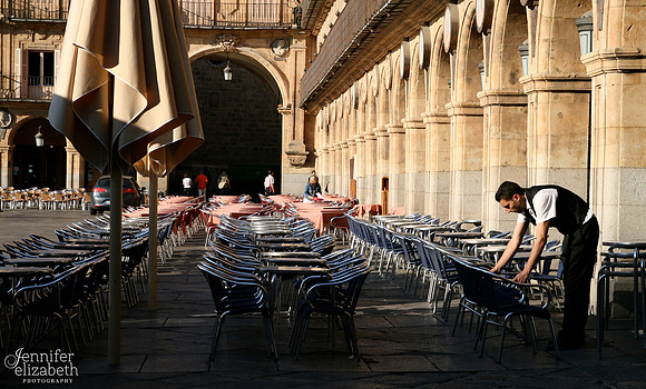 Waiter Setting up Restaurant Tables in Salamanca, Spain