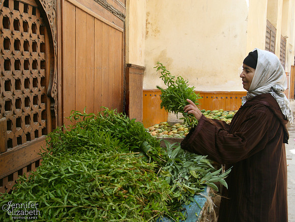 Woman buying Mint in Fès, Morocco